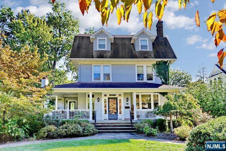 Set on almost an acre of beautifully sloped property, this timeless Ridgewood Colonial offers quintessential charm inside & out - from its inviting wraparound front porch to the perfect sledding hill in back. Originally built in 1904 and thoughtfully expanded over the years, the home offers 6 bedrooms that can flexibly serve as bedrooms or offices if needed. With living spaces spread comfortably across four floors, the layout adapts easily to families of all sizes and stages. The gracious LR features two distinct sitting areas, anchored by a fireplace on one end and built-in bookcases on the other, & flow seamlessly into a spacious DR perfect for gatherings. The chef's kitchen is well appointed with premium appliances, including a Sub-Zero refrigerator, 48" dual-fuel Wolf range, and Miele dishwasher. A built-in desk overlooks the backyard, and the side door patio is the perfect place for a potted herb garden. The inviting GR features a beautiful stone-fireplace and is accessible from the kitchen, front porch, and back deck. The grade level LL features a cozy den, mudroom, laundry room, generous storage area, and access to 2 C garage. Homes of this era were built with quality materials and thoughtful design and this home still features the original leaded glass vestibule doors. Ideally located a couple blocks to Willard Elementary, the Ho-Ho-Kus Train Station, and the GW Middle school bus stop. This property offers someone the opportunity to have a truly special home.