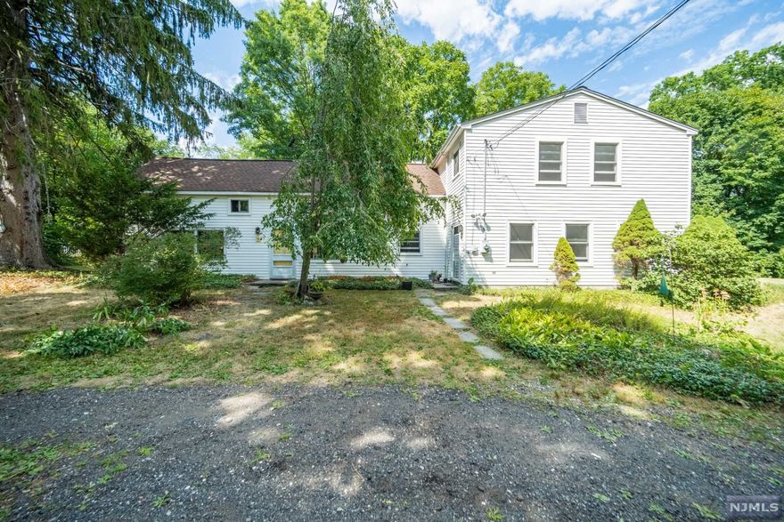 Come see everything this 3 bedroom, 2.5 bathroom 2-story has to offer! This farmhouse chic home sits on 0.6 acre of land and is perfectly located near the West Milford town center. The gorgeous and bright living room along with the eat-in-kitchen welcome visitors, both featuring beautiful windows that allow natural light and year-round seasonal views. Off the kitchen is the powder room and a large pantry with additional counter space. The first floor also features a dining room and a family room with a beautiful brick fireplace. The upstairs includes a Primary Suite with an attached full bath, along with two additional bedrooms, a full bath, and an office space. You won't want to miss this one!