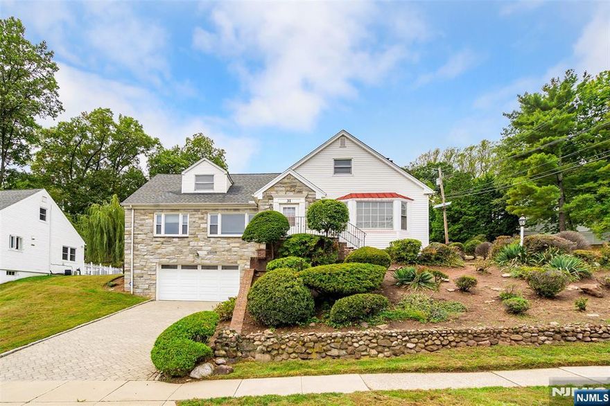 Spacious 5-bedroom, 3-bath Colonial Cape located in the highly sought-after Gregory section of West Orange, featuring stunning New York City views. This expanded home offers an abundance of living space, with generously sized rooms, a full bath on every level, a finished basement, and a flexible second-floor layout ideal for work-from-home options. The first floor features a welcoming foyer, bright living room, formal dining room, and large eat-in kitchen, along with two bedrooms and a mudroom providing access to the yard. The second floor includes three additional bedrooms, a den, and a large sitting room that can serve as a second living area or home office. Situated on a 91' x 103' lot, the property offers outdoor living space with a slate patio and level lawn area. A two-car built-in garage with interior access and a brick paver driveway accommodating four cars adds both convenience and curb appeal. Prime location for commuters with easy access to NYC trains and buses. Close to Rock Spring Golf Club, Turtle Back Zoo, South Mountain Reservation, the Dog Park, and the Fairy Trail, as well as schools, shopping, and dining. Bring your vision and make this spacious Gregory-section home your own.