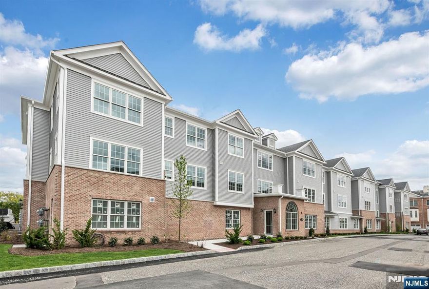 A Rare, End Unit, Park View, 2 Bedroom, 2 Full Bath with Covered Terrace is available! Enjoy the 55+ active, full amenity lifestyle at the desirable Paris Square! Easy living is apparent upon entering your spacious, approximately 1460 square foot unit, and seeing the gorgeous, open design showcasing the stunning MEIK w/ multiple seating/dining areas, 2 spacious bedrooms & 2 full baths, including the magnificent Owner's Suite. High ceilings and large windows capture the natural lighting and views or simply step onto your spacious, private, covered terrace. Energy efficient systems, designer detailed kitchen & baths, hard wood flooring, stunning light fixtures, quartz counters & W/D are featured along with many upgrades such as new refrigerator and dishwasher, Smith & Noble window treatments, soft close, pull out drawers throughout, ceiling fans, kitchen crown molding, smart thermostat, medicine cabinet, framed mirrors in both baths, designer shower bars and an abundance of closet shelving! This incredible home has GREAT closet space! Amenities include clubhouse w/ fireplace, kitchen, gym, pool, theater, garden, putting green & walk path thru 64,170 Sq Ft of landscaped park! HOA includes Onsite Super, water & flood insurance, along with amenities, landscaping, snow removal and more. Nearby golf, shopping restaurants, hiking & trans! Social, Active Community in a Beautiful Setting!