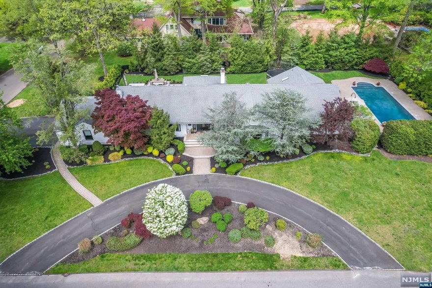 One of Haworth's best locations, STUNNING property. Fully gut renovated (4 years ago) sprawling ranch situated in the highly coveted town of Haworth. Pristine home, nothing left unfinished. Grand entrance into your great room with vaulted ceilings and wood burning fireplace. State of the art modern eat in kitchen with 10' island. Adjacent den with linear gas fireplace, attached to your very large dining room. The spacious primary bedroom ensuite opens its doors which leads to a brand-new gunite pool, while three additional large bedrooms and an extra-large office/5th bedroom offer versatility. Outside, a new outdoor kitchen and patio provide the perfect setting for entertaining. Experience the pinnacle of luxury living in this impeccably crafted residence, where every detail has been thoughtfully curated to elevate your lifestyle to new heights. Welcome home to a life of unparalleled elegance and sophistication in the heart of Haworth. Homeowner has real estate license.