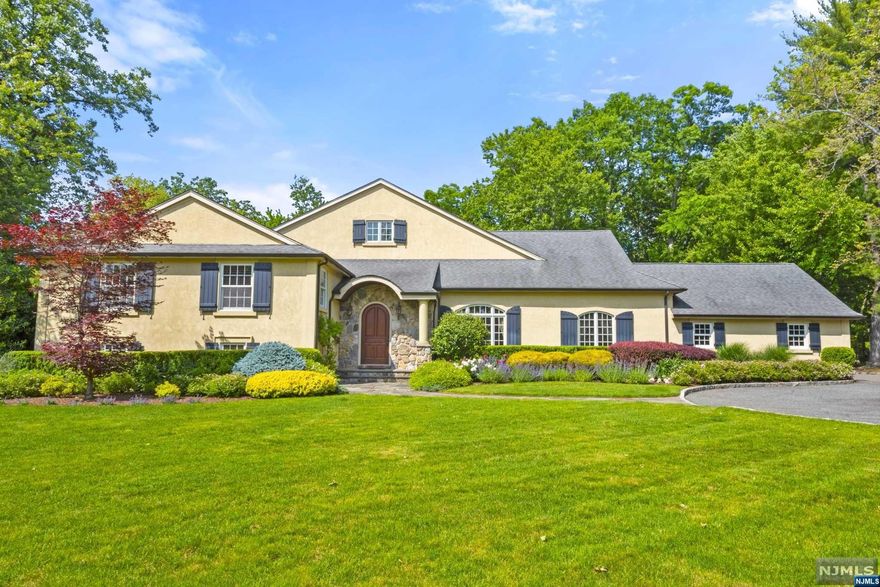 Nestled on close to an acre in Livingston's prestigious Coventry neighborhood, you will be captivated by the meticulous attention to detail and the luxurious finishes that define this remarkable custom-built and lovingly maintained home. The home's main level boasts a dramatic great room with a grand fireplace, an oversized formal dining room, and an inviting living room with a flow designed for entertaining. The heart of the home lies within the expansive gourmet kitchen, a haven for culinary enthusiasts. In addition, there is a large first-floor office which easily can be a 5th bedroom. The primary suite is a luxurious, serene retreat with a sitting area, WIC's, and a spa-like en-suite bathroom. The grounds of this resort-like property invite you to bask in the tranquility of your own private oasis. The centerpiece is a sparkling pool that is perfect for enjoying warm summer days and creating memories. This home is a gem with its thoughtful layout and architectural charm!