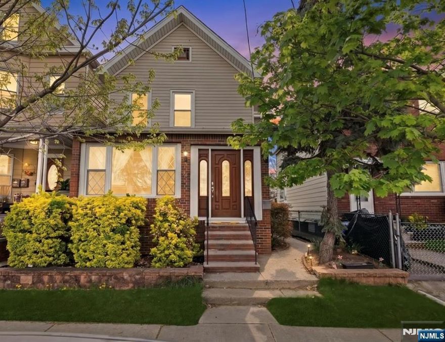 Upon entering, youâ€™ll immediately appreciate this cozy, well-maintained home offering 3 bedrooms, 1.5 bathrooms, and a partially finished basement. The main level features a spacious living room, a dining area that seamlessly flows into the kitchen, and a convenient powder room. Upstairs offers three bedrooms and a full hallway bathroom. The partially finished basement provides a versatile recreation/family room, laundry area, and walkout access to a nice-sized backyardâ€”perfect for entertaining or everyday enjoyment. Additional highlights include an open floor plan and gleaming hardwood floors throughout. Ideally located near schools, shopping, and NYC transportation (bus and train). In addition, direct bus to MetLife Stadium. This home is a true commuterâ€™s dream.