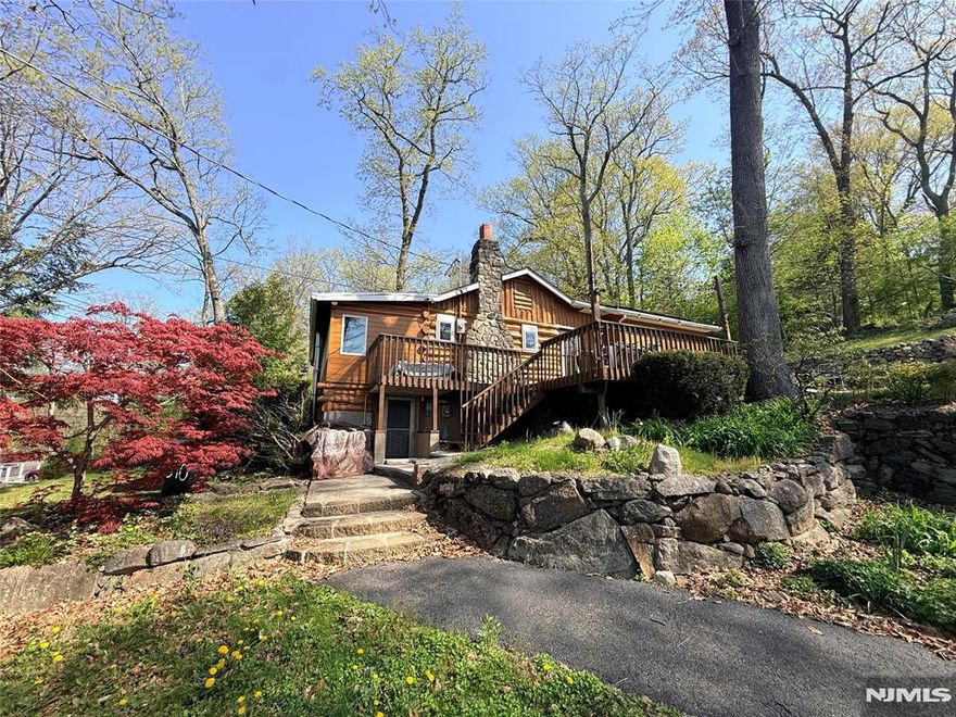 This beautifully maintained 2-bedroom, 1.5-bath home offers the perfect blend of rustic character and modern comfort. Natural wood, sunlight pouring through the windows, and peaceful lake views create a warm and calming atmosphere from the moment you walk in. The home has been tastefully decorated, blending classic cabin character with practical updates like energy-saving solar panels(owned) and water filtration system. There is a fireplace on the main level as well as a wood burning stove in the basement. The full bathroom has access from the primary as well as the hallway, 2nd bedroom includes a half bath. Outside you will find a private driveway, artist's shed/workspace, and quiet spots to enjoy morning coffee while taking in the surrounding nature. Whether you're looking for a full-time home, weekend escape, or creative retreat, this Erskine Lake (membership optional) cabin offers a rare mix of charm, light, and lake community living.