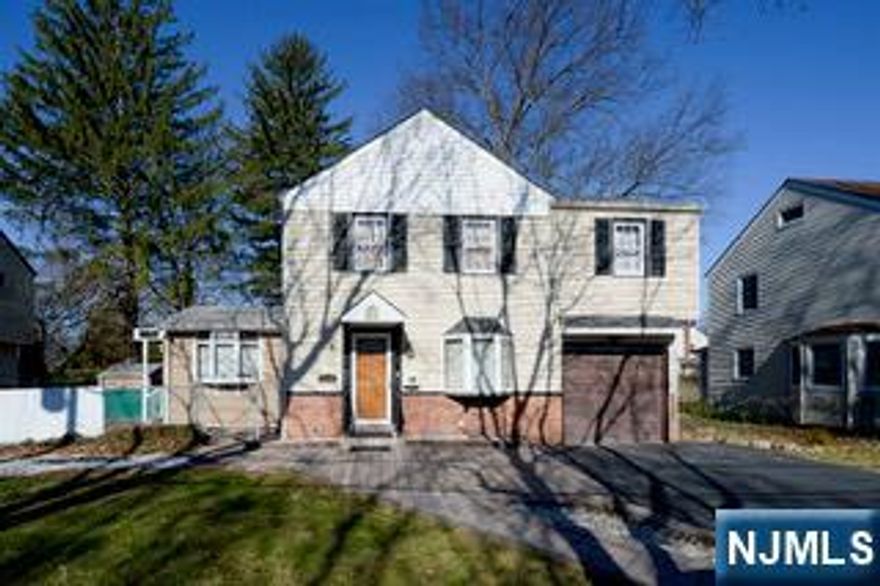 This classic 3 bedroom. 1.5 bath traditional colonial style expanded home is full of potential and waiting for your personal touch. Nestled in a sought-after East side location, this home offers a fantastic opportunity for renovation and expansion. Enter to a living room, a dining area, kitchen with newer appliances, extra dining space with a side entrance and a sliding glass door to a nice size yard., family room has a fireplace and a powder room. Second floor features three bedrooms and a full bath. The basement is partially finished with a laundry room. Enjoy the town of Paramus, with great recreation, parks, proximity to NYC and low taxes. Located near houses of worship, Van Saun County parks and Malls. Very well maintained and sold "as is"