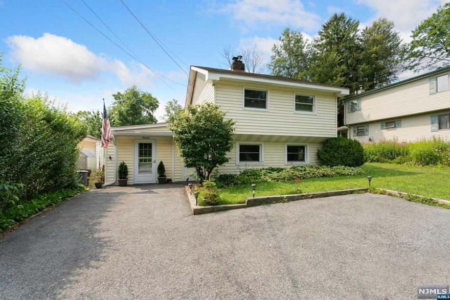 Great opportunity with this roomy 3 BR, 2 Full Bath Colonial, move-in ready! Located in a private corner of Upper Greenwood Lake. Enter into an oversized foyer that can be your own sitting room or office, has potential to be converted to a 1st floor bedroom & another bath can be added to the back room where the laundry is. Main living area features Cozy living room w/ wood burning FP w/ insert & opens into large eat-in country kitchen. Second level has 2 full baths and 3 good sized bedrooms, including a large MBR w/vaulted ceiling. Nicely landscaped yard. Plenty of parking! UGL has members-only beach & clubhouse with swimming, boating, boat launch, outdoor pavilion, fishing & kayaking. Close to Warwick NY restaurants, Drive-in theater, golf, wineries, skiing & orchards. Minutes to NYC express park & ride and 1 hour into NYC. Home is part of an estate and is being sold "as is". Septic has no known issues & is fully functional. New Price reflects "as is" sale, including septic.