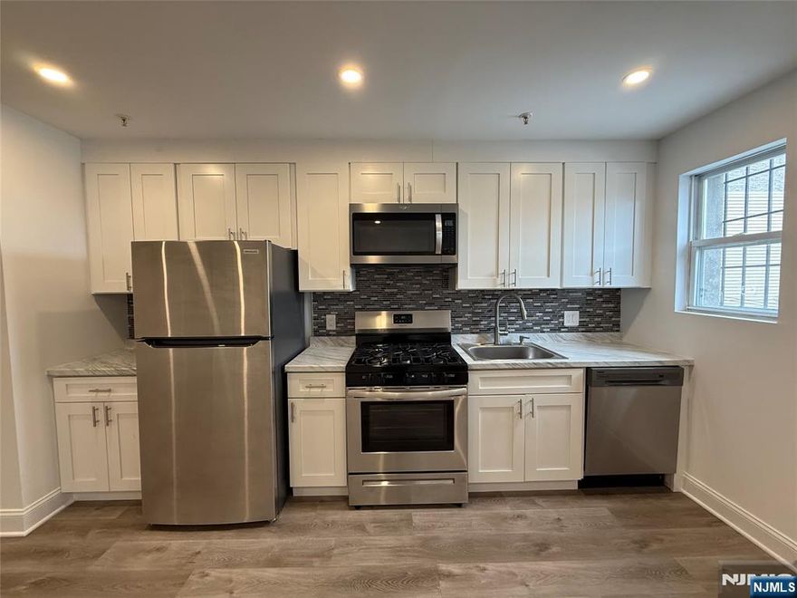 Move right into this STUNNING 3 bedroom 1 bath unit on Bergenline Ave in West New York! Conveniently located for an easy NYC commute, not to mention the endless restaurants, shops, grocery stores in this vibrant neighborhood. Fully renovated with a modern touch this unit offers new appliances, ample closet space, and an open floorpan for the dining/living-room/kitchen. Your very own washer and dryer is a huge plus as well as central air and heat! Heat, hot water, and cold water are all included in the rent, tenant is only responsible for electric. Come see this beautiful unit today.