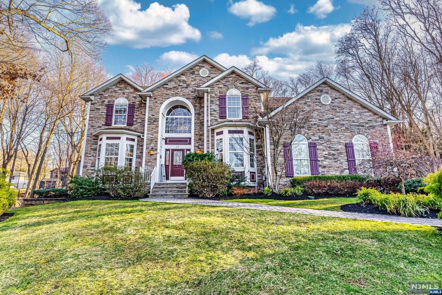 **Highest & Best due by Tuesday 3/19 at Noon. This luxury 4 BR, 3.5 bath center hall colonial in prime commuter location of Towaco is an entertainer's dream! 1st FL feat. 2 story grand foyer w/cathedral ceilings & stunning chandelier w/lift, LR w/vaulted ceilings & gas FP, DR, office, den, 1/2 bath, laundry room & EIK feat. center island w/SS appliances, wine fridge & wet bar. 2nd FL boasts 3 guest BR, FB w/tub/shower & dbl vanity, linen closets & primary BR w/tray ceilings, 2 WIC & FB w/stall steam shower & jetted tub. The finished basement offers a FR complete w/game room, gym, family room FB & "speakeasy" style bookshelf door that leads to storage. Other feat. incl. 2 car garage w/epoxy floors, security system, Bose speakers throughout, multi-unit heating & cooling, generator h/u, sprinkler system, built in safe, maple HWF w/custom tile inlays, central vac & a 4 year old expanded Wolf deck overlooking the flat, fully fenced in yard!