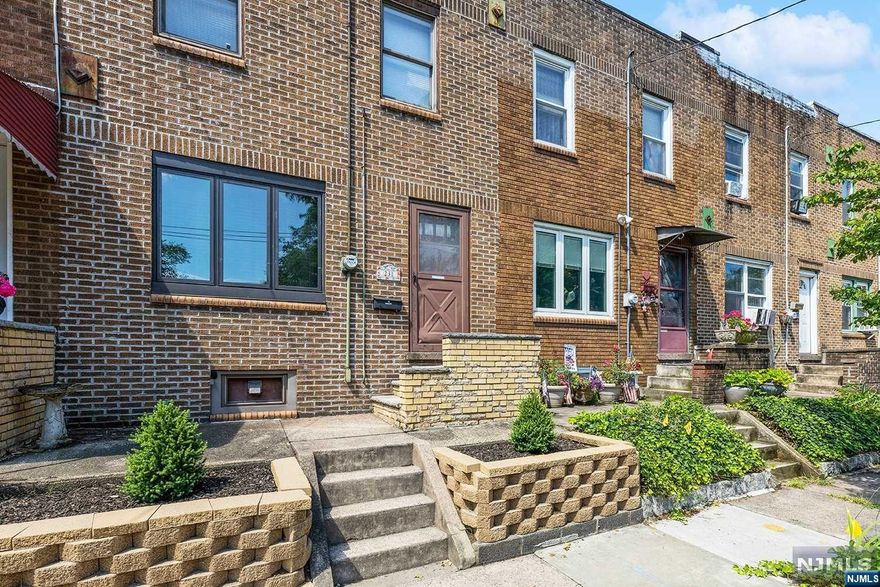 Ready for new homeowners to move right in! First floor offers eat-in-kitchen with newer stove top, closet (that may be easily converted into pantry), and cozy living room. Two bedrooms with ample closet space are located on the second floor. Other amenities include: central A/C, hardwood floors throughout, updated bath (replaced tiles, sink and toilet) and painted/treated deck. Basement provides even more versatility and features room for laundry, storage and utilities. There are 2 assigned parking spaces. Do not miss your chance at owning this lovely home! It is conveniently located: a short drive to Goffle Brook Park, Route 208, shopping, restaurants and more.