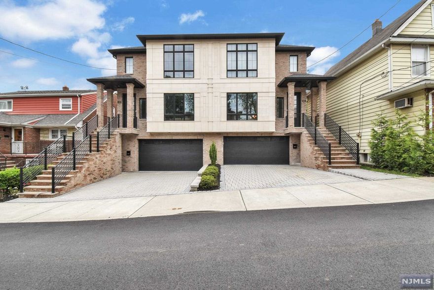 Welcome home! This 3 bedroom, 2 full bath, 2 half bath custom built duplex defines luxury living. Fit and finish must be seen! The 1st FL features a large open concept living room w/ fireplace, dining room w/ oversized modern chandelier. The kitchen features high-end appliances, wine fridge, insta hot /cold faucet, oversized island w/ wet bar sink, bonus cabinet storage and custom walk-in pantry. Open to the kitchen is the guest bathroom and large family room w/ fireplace and duel french doors open to the upper deck area. On the 2nd FL you'll find the primary suite w/ bath, radiant heat floors, oversized shower, spa tub, double sinks and custom walk-in closets. 2 additional well appointed bedroom, full bath with heightened ceiling w/ radiant heat floor and laundry area. The full finished basement features garage entry, radiant heat floors, mudroom, entertainment room with custom bar, spare room / office with built-in murphy bed.