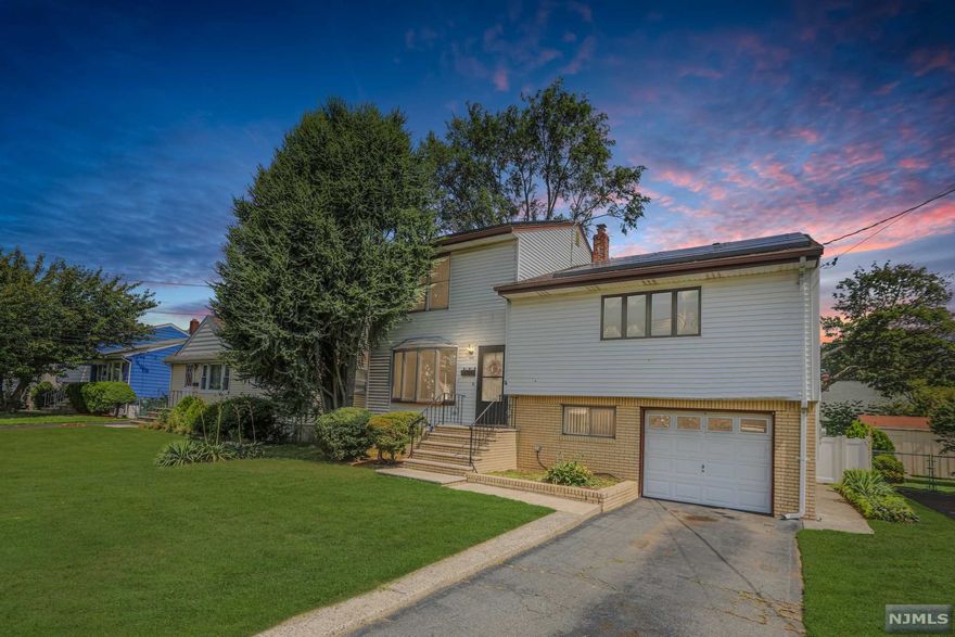 WELCOME HOME! This stylish expanded split level is nestled on leveled lot in a desirable location of Clifton near all public transportations, major highways and multiple shopping centers and restaurants! Cool, calm and sophisticated with a youthful edge. This functional home is enveloped in light and comfort with its crisp earthy walls and fine finishes. Featuring 4 bedrooms , 2 Full Bathrooms, Powder Room, Living Room, Eat in Kitchen with an island leading to a brand new TREX deck overlooking a private fenced in yard, Lower Level Family Room/Finished Basement, Summer Kitchen, attached garage and much more!