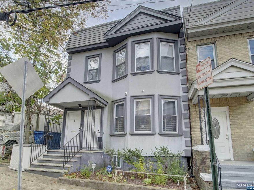 This 2 family home is ideal for any investor or home owner. The first unit boasts gleaming hardwood floors throughout with the exception of the kitchen and bath. There is a large living-room, dining room, full bath, 2 bedrooms and a Kitchen to finish this level. The kitchen has granite countertops with a peninsula for extra seating. It's important to mention just how large the bedrooms are in the home. On the second unit you have the exact same setup. You have cherry hardwood flooring throughout and tile in the kitchen and bath. A living-room, dining-room, kitchen, bath and 2 large bedrooms. Both the units have hot forced air and central ac. To finish this home there is a basement that is partially finished and walk-out with 2 rooms, a bathroom, utility room and open area. Finally there is a massive backyard for all your entertaining. The home is close to schools, shopping, highways and more. THIS HOME QUALIFIES FOR UP TO $17,500 TOWARDS CLOSING COST AND DOWNPAYMENT.