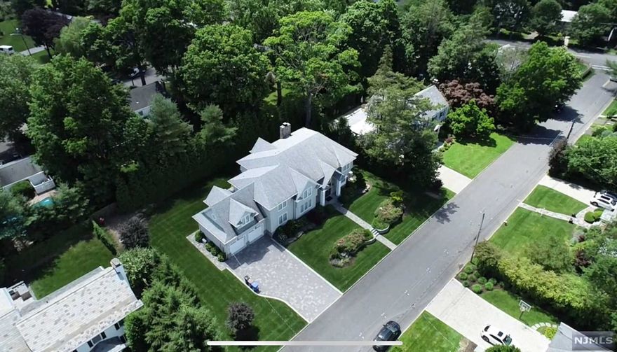 Welcome home! Top quality construction and finishes w/attention to every detail by local builder.The 2-story foyer w/circular staircase opens to large Dnrm that features coffered ceiling & Lvrm that showcases a walnut inlet floor. The custom gourmet kitchen w/ Subzero/Wolfe appliances & quartz counter-tops opens to over-sized Fmrm w/gas FP. 1st flr office includes fbath. A 1/2bth & Lg mud RM complete this floor w/access to 2 car garage. The 2nd flr offers over-sized Mbrm w/ trey ceiling, his/her walk-ins & sitting area. 3 add'l bdrms,2 baths, den/office & laundry complete second floor. LL features custom media rm, rec. rm w/custom built bar, Bdrm, Fbth. Impressive wine refrigeration system, gym & fbth. Private yard w/blue-stone patio w/fire pit & built-in grill, perfect for outdoor entertaining. State-of-the-art audio system, spray foam insulation, surveillance cameras, 5Z heat/air conditioning, hardwood floors & custom moldings & trim throughout. Theres more, come see