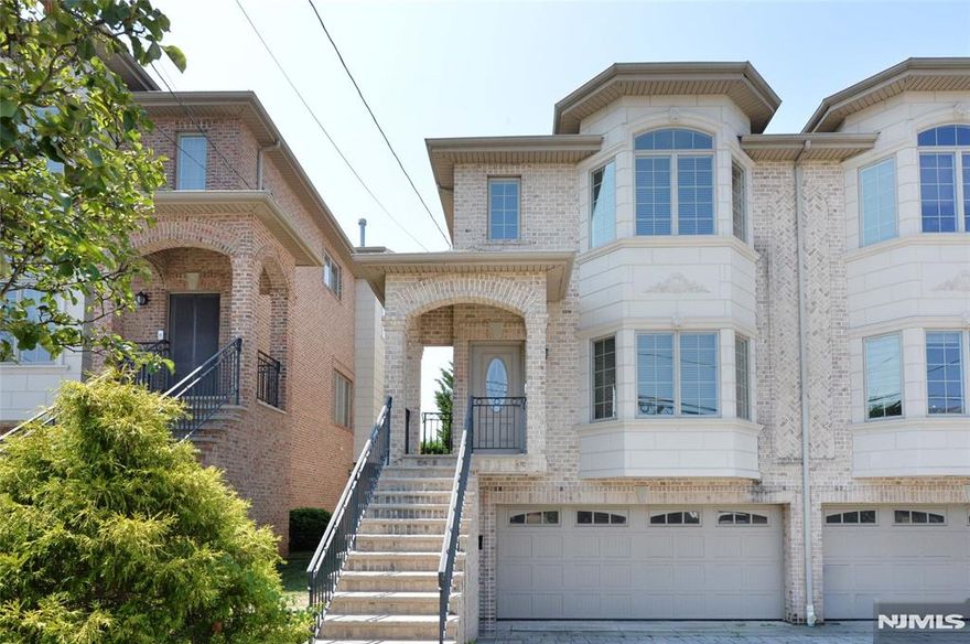 This beautifully designed 3-bedroom, 3.5-bath townhome combines spacious living with upscale finishes in one of Palisades Parkâ€™s most desirable neighborhoods. The main level features an open-concept layout with gleaming hardwood floors, a bright living room with a gas fireplace, and a dining area that flows into the modern kitchenâ€”complete with granite countertops, stainless steel appliances, and a large center island. Sliding doors lead to a private balcony, perfect for morning coffee or evening relaxation. Upstairs, the serene primary suite offers a plethora of closets and a spa-like ensuite bath, complemented by two additional bedrooms and another full bath. The finished ground level includes a versatile family room, full bath, and direct access to the attached 2-car garage. Additional highlights include a central vacuum system, powder room on the main level, and abundant natural light throughout. Located near shops, dining, parks, and NYC transportation, this move-in-ready home delivers both comfort and convenience.