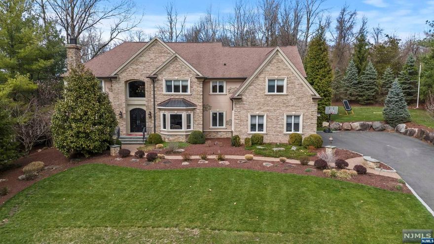 Indulge in luxury living with this exquisite 6-bedroom, 5.5-bathroom Colonial. Every detail of this opulent home has been meticulously crafted to offer the utmost sophistication, and style.Enter the home and be greeted by the grand foyer and be wowed by the timeless elegance of coffered ceilings and intricate moldings that adorn every corner of this magnificent estate. A culinary haven awaits in the gourmet kitchen with top-of-the-line appliances including a Sub-Zero fridge and a Wolf gas range. For added convenience, a separate full-size fridge and freezer cater to all your storage needs. Entertain with flair in the expansive living spaces, where gatherings are elevated by the ambiance of the 300+ bottle wine cellar, perfect for connoisseurs and enthusiasts alike. Outside, a true oasis awaits. Entertain al fresco in style with not one, but three grills and a fully equipped outdoor kitchen, allowing for seamless entertaining. Take a dip in the heated pool in your private retreat.