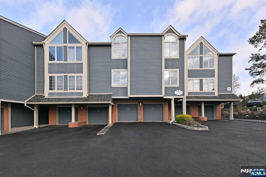 Beautiful, open concept, townhome in the prestigious, gated community of Cambridge Heights with pool, tennis and exercise room! Garage access right into home. The beautiful kitchen with stainless steel appliances overlooks the dining room and living room which offer stunning hardwood flooring, recessed lighting and wood burning fireplace. Access to the covered deck overlooks the beautiful grounds. The primary bedroom is spacious, primary bath/double sinks. The 2nd bedroom and full bath complete the main floor. Lower level offers a family room with wood burning fireplace, full bath, and access to Garage. This desirable community is minutes from Ramseyâ€™s vibrant downtown, shopping, dining, major highways, and train service to NYC. The perfect blend of comfort, convenience, and community living. Love where you live!