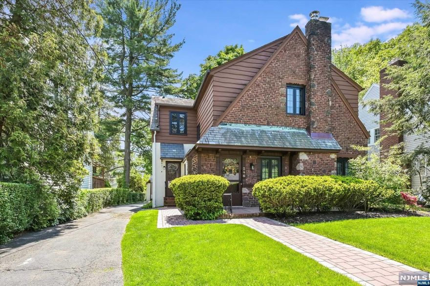 You'll be impressed by this lovingly maintained Tudor home located in the sought after Manor section of Englewood. From the artistic brick, stucco, and cedar exterior with slate roof, to the authentic hardwood floors, this house is a treasure. Step into the sunken LR w/fpl and 11ft beamed ceiling, which leads to the FDR and charming EIK with SS appliances, quartz counters, birch cabinetry, and breakfast nook. Den opens out to a flagstone upper patio w/wrought iron railing, leading to a lower-level flagstone patio overlooks a lush green lawn, perfect for outdoor entertaining. A large primary bedroom, two additional bedrooms and a FB complete the 2nd floor. Finished bsmt offers office/family room, laundry room, and storage. Architecturally correct Andersen windows throughout the house, along w/a new paver walkway. This is a rare opportunity to acquire an exceptionally maintained and pristine home in one of Englewood's most coveted neighborhoods.