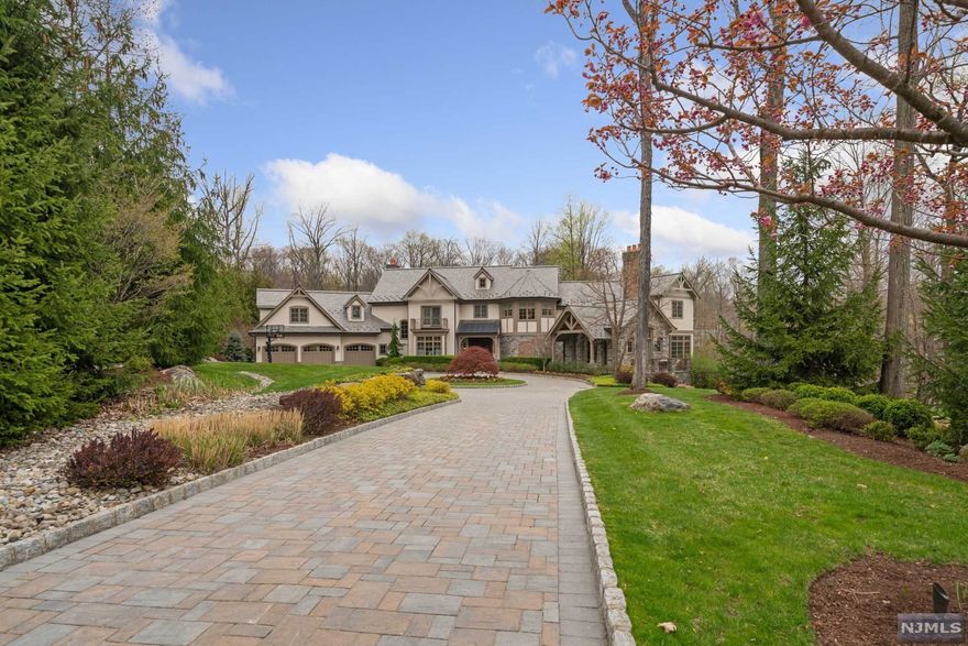 Finest estate ever offered in town! Custom built by Gary Pritchard, part of a private enclave in Morris County, known as "The Pond." Nestle on 2.26 acres it's location is convenient to commuter routes yet provides you w/ seclusion, privacy & solitude. Majestic inside & out this home boasts over 11,000 sq.ft. for everyday living or entertaining. Kitchen features fireplace, quartzite counters, center island & walk-in butler's pantry. Main level hosts family rm, living rm, sunroom, formal dining, office, wine cellar, 2 powder rms, laundry & mud rm w/ custom built-ins. Upper level provides 5 BRS including the master w/ lavish bath, sitting rm, 2 walk-in closets, & gas FP. 4 addl. en suite BR ea feature custom built-ins & walk-in closets. For easy living an addl. laundry rm completes the 2nd fl. Walk-out lower level offers a billiard rm, movie theater, gift wrapping rm, gym, family/rec. game rm & plenty of storage. Resort style backyard w/ pool etc. Must See to much to list.