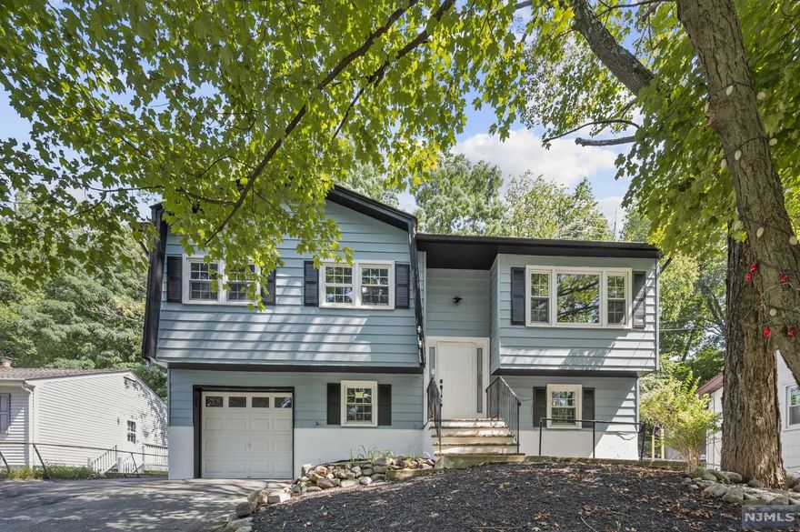 COMPLETELY RENOVATED 3 bedroom 2.5 bathroom Bi-Level home with BEAUTIFUL FINISHES located in the ULTRA-DESIRABLE White Meadow LAKE COMMUNITY! Very spacious layout that is totally OPEN-CONCEPT & ideal for entertaining! Kitchen features a huge island, with sparkling white quartz countertops, brand new custom cabinetry, & SS appliances. Sliding Glass Doors lead you to a HUGE DECK with stairs down to the yard. The Primary Bedroom features an En-Suite Bathroom. 2 additional spacious bedrooms & another full bathroom complete this level. The Ground Floor hosts huge family room with a 1/2 bathroom for your convenience plus SGD to the backyard. Central Air, Attached Garage, hardwood floors, plus so much more. Don't miss this home! Convenient location close to major highways and transportation!