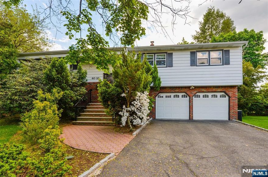 Welcome to this beautifully updated 4-bed, 2.5-bath bi-level home for rent in the heart of Fair Lawn! Located in a vibrant community with top-rated schools, parks, and easy NYC access, this home offers comfort and convenience. The entry level features a spacious family room, powder room, laundry, and a large bedroom ideal for guests or a home office. Upstairs, enjoy an oversized modern kitchen with white cabinetry, stainless steel appliances, and a center island with bar seating. Step out onto the deck for outdoor dining or relaxing with a backyard view. The open living and dining rooms are bright and inviting, perfect for everyday living and entertaining. Down the hall are three more generously sized bedrooms and two full baths. With its modern updates, versatile layout, and unbeatable Fair Lawn location close to schools, parks, shopping, and major highways, this home truly has it all!