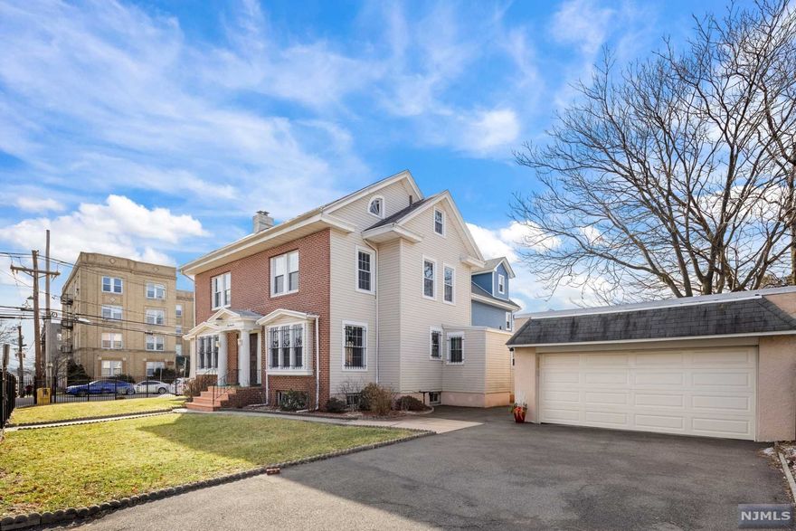 BACK ON THE MARKET. Classic center-hall colonial in historical Forest Hill Newark! This stately home offers approx. 2,600SF of living space and 6 parking spaces with plenty of room to entertain as you move with ease from living room, sunroom, kitchen, and formal dining room with dramatic coffered ceilings. Stand in your foyer and marvel at the surrounding old world charm. With 6 total bedrooms and bathrooms on every level, this home is sure to check all the boxes. Other highlights include a newer gas boiler, 2-car garage, slate roof, full unfinished walk-out basement with separate laundry room. Ideal location, 3 blocks from Branch Brook Park offering 360+ acres of picturesque trails, recreation, and the magic of the annual cherry blossom festival. Just down the block to Robert Treat Academy, a National Blue Ribbon School, and half a mile to the light rail station. With a few light cosmetic touches, this Forest Hill gem is just waiting for you to make it your own! Sold as-is.