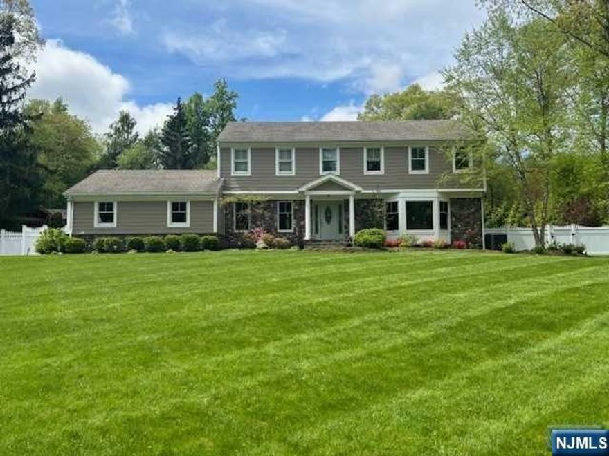 Remarkable colonial in a paradise setting in one of the most sought after areas in Montvale! This unbelievable property features a main house and guest/pool house. Main house boasts 5 bedrooms, 3.1 baths, living room with bay window, dining room with chair rail moulding, oversized kitchen overlooking the gorgeous yard, family room off kitchen with fireplace, & big finished basement with bedroom, bath, office, built-ins and wet bar. Guest house includes large living area with stone fireplace, bonus area with pocket doors (could use as a bedroom or dining room), kitchen, full bath, and washer/dryer hook ups. The outside is an oasis in itself: 1.1 acres of beautifully manicured grounds with an infinity edge saltwater pool with waterfall, & built in spa/hot tub. Bluestone patio surrounds pool & guest house. Separate patio outside of main house. This is an extremely rare opportunity not to be missed!