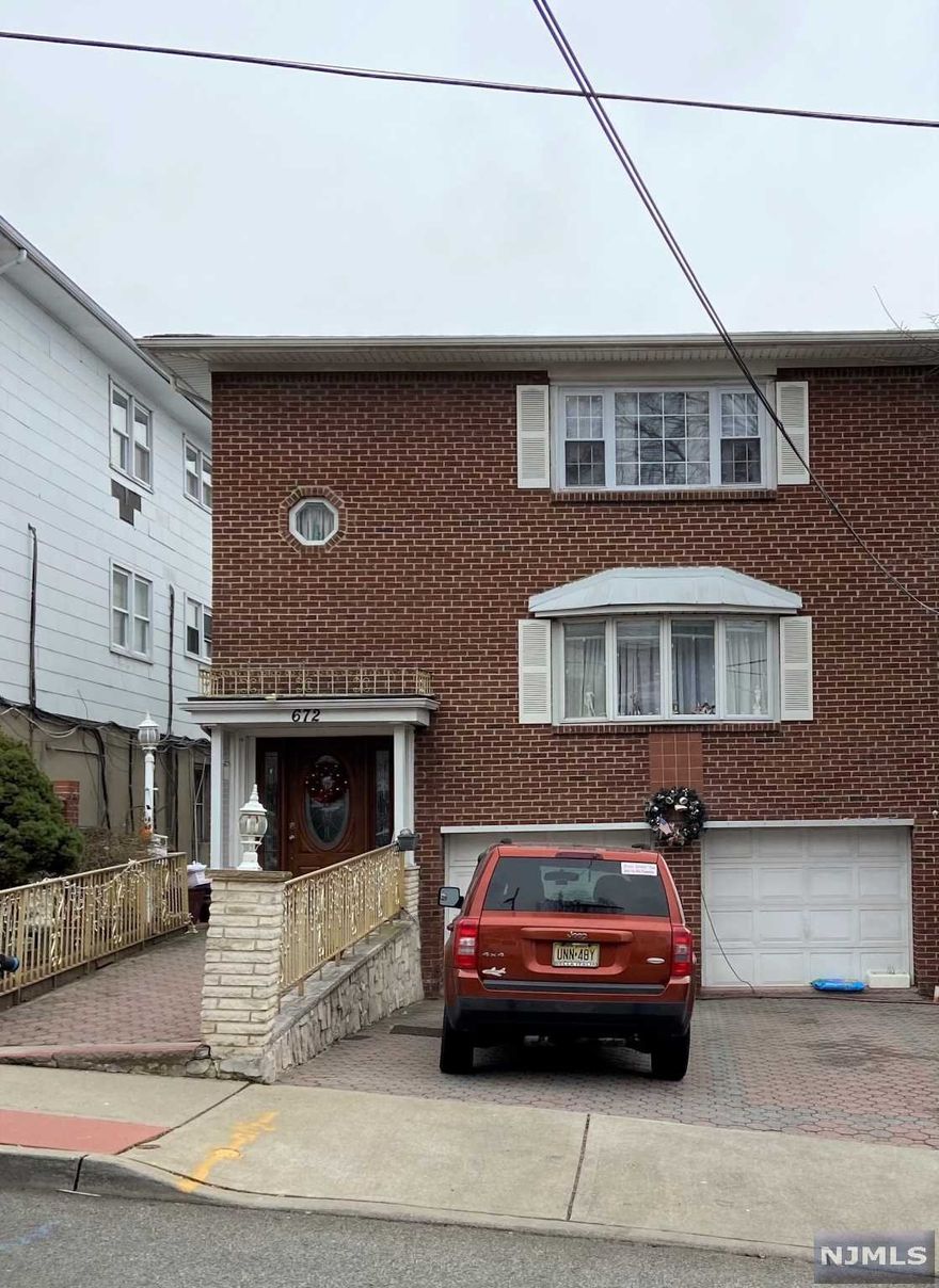 Large 3 family home. Two rental units plus owners apt Same owner since house was built in 1972. Both hardwood and ceramic tiles throughout most of the rooms in the house. Two gar garage. Large backyard patio for entertaining . Separate utilities. Near NYC bus transportation