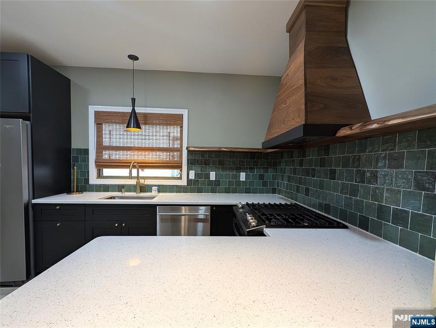 Stylish First-Floor Apartment in Prime Location! Fully renovated first-floor unit with two spacious bedrooms and ample closet space, this bright apartment is filled with natural light from numerous windows. The modern kitchen features high-end finishes and quartz countertops, perfect for culinary enthusiasts. Enjoy a chic bathroom with a shower and soaking tub combo. Washer and Dryer are in unit. Conveniently, ALL utilities are included in the price. Ideal for commuters, 30 minute bus to NYC is right around the corner, and highways are easily accessible. Easy on-street parking and shared backyard! Don't miss outâ€”schedule a viewing today!