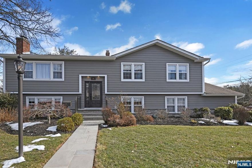 Welcome to this five-bedroom, three full bath home. The ground floor features: large family room with a fireplace, kitchen with stainless steel appliances (2020) and bedroom, full bath, laundry, utilities and second bedroom with built-in double office cabinets and desktops (2023) and two car garage. First Floor features: formal living room with fireplace, formal dining room, modern eat-in kitchen with sliders to oversized Trex Deck (2021), Primary bedroom and bath, two additional bedrooms and full bath. Special features: fenced-in back yard, Ester Williams above-ground pool, newer Ester Williams pool liner (2023), Nirvana pool heater (2021), large patio for those relaxing summer nights, professionally landscaped, sprinkler system, central air (2021), central vacuum, James Hardie Ceder Mill Fiber Cement Siding (2020), outdoor lighting (2021), newer gutters (2021), exterior stonework (2021), front railings (2023) and a Mahagony front door (2023). Don't miss out on this Emerson Gem!