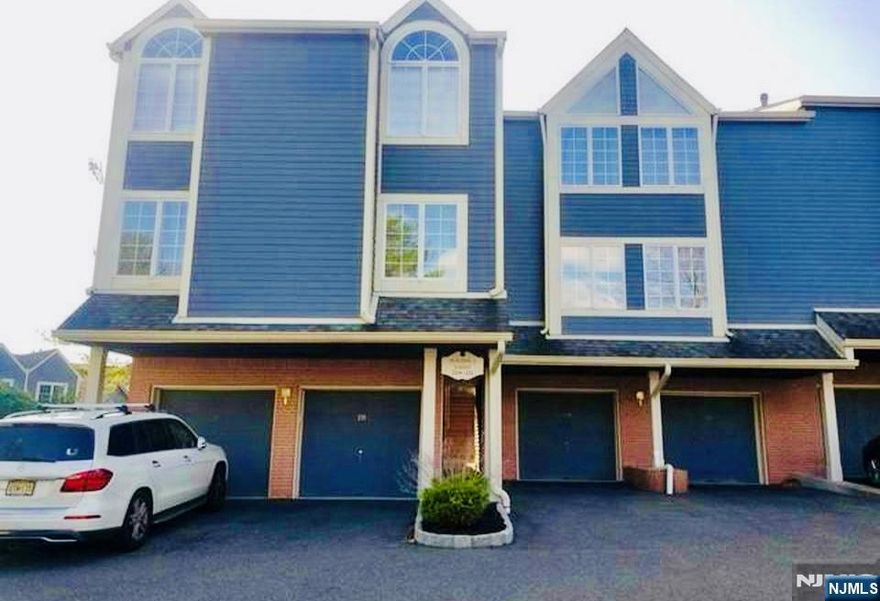 Welcome to this spacious light and bright 2-bedroom, 3-bath corner unit townhome located in the highly sought-after Cambridge Heights gated community. This beautifully updated home offers an open floor plan featuring a modern kitchen with granite countertops and breakfast bar, a dining area, and an oversized living room with hardwood floors, a cozy fireplace, and French doors leading to a private deck. The finished lower level provides a family room or home office with fireplace, a full bath, laundry area, and access to the attached garage with extra storage. The master suite boasts a beautifully renovated bathroom for your enjoyment. Enjoy resort-style living with 24-hour gated security, a clubhouse, swimming pool, tennis courts, and convenient access to NYC transportation, train station, shopping, and top-rated schools. Lease Details: Tenant responsible for first $150 of repairs. Tenant insurance required. No pets. No smoking.