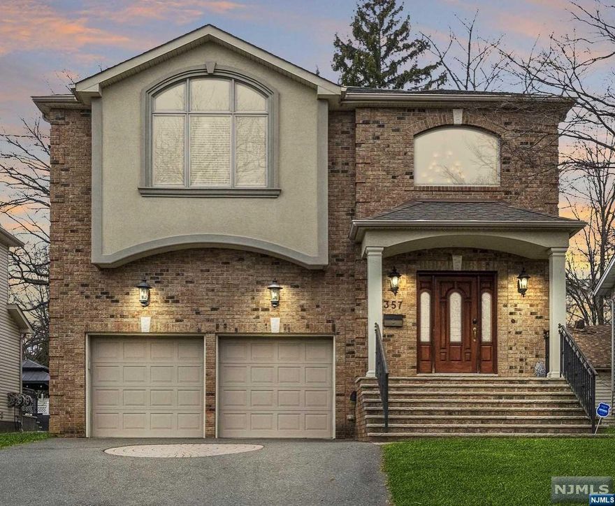 Embrace luxury living just minutes from the heart of NYC with this meticulously maintained Colonial. Offering 4 bedrooms, 4.5 bathrooms, and over 3500 square feet of living space, it provides unparalleled comfort and sophistication. Entertain in the grand family room with 18-foot ceilings and a fireplace, or indulge your culinary desires in the chef's kitchen. Upstairs, find a serene primary suite with a fireplace and luxurious en suite, along with three additional bedrooms. The finished basement offers endless possibilities. With hardwood floors throughout, a great yard, and a large two-car garage, this home is a rare find. Just blocks from public transportation to NYC and Nutley's top-rated schools, seize the opportunity to live in luxury while enjoying easy access to the bustling city. Schedule your private viewing today