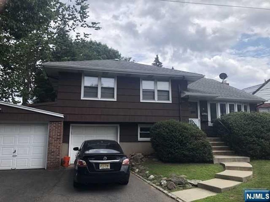 This is a special 2 family. It is a split level house with 2 apartments. 1st apartment was completely updated 2 years age and consists of a LR, Eat-in kitchen and bedroom on the 1st level, then down a few steps to a family room (could also be used for a 2nd BR), laundry room, full bath and entry to attached garage. 2nd apartment consists of a huge LE, eat-in kitchen, laundry room, .5 bath on 1st floor and up a few steps to a huge bedroom. There is also some attic storage in this apartment. Features hardwood floors, separate utilities. Front and rear entrances for each apartment. Large deck on apartment 2 and patio for apartment 1.