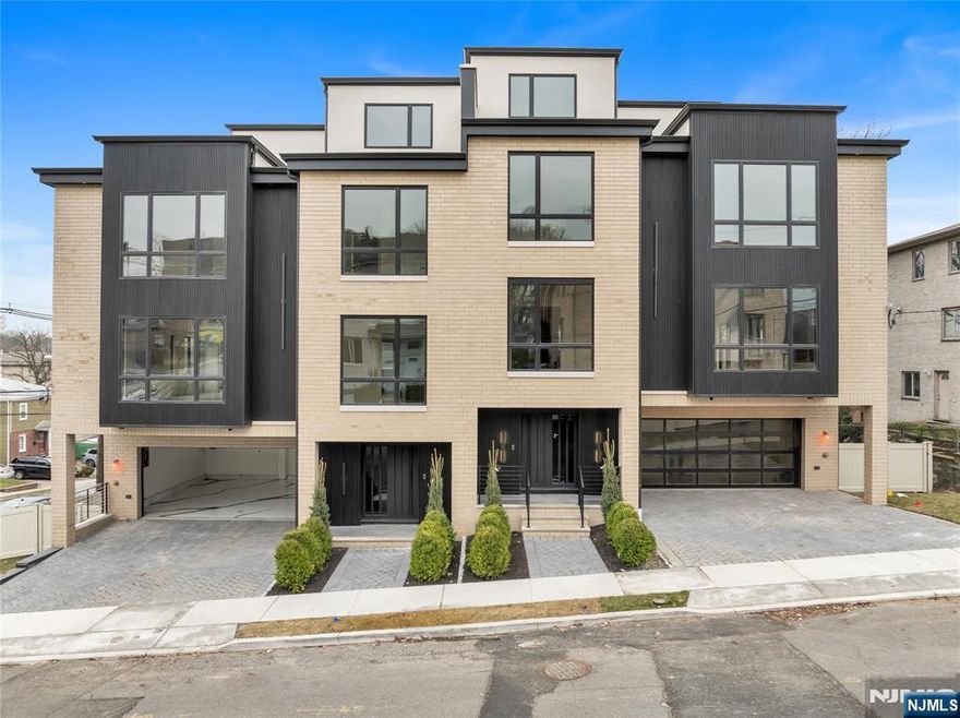 2220 Mackay Ave â€“Introducing an extraordinary new construction townhouse offering 5,500 square feet of living space, where modern luxury meets thoughtful craftsmanship. Truly one of a kind, this oversized residence delivers grand scale, refined finishes, and exceptional functionality across multiple levels. The main living level features 9' ceilings and an elegant flow ideal for everyday living and entertaining. Highlights include open staircase, spacious living room with custom built-ins and fireplace, dining room with wet bar, private office, a sun-filled family room , and modern eat-in kitchen, showcasing two-toned cabinetry, an oversized center island, and sleek integrated appliances. The bedroom level offers four generously sized en-suite bedrooms, including a luxurious primary suite complete with walk-in closets and spa-like bath accommodations. Rooftop level is an entertainerâ€™s dream, featuring a wet bar, loft-style living area, additional bedroom, full bath, and an expansive outdoor terraceâ€”perfect for hosting or relaxing with skyline views. The ground level opens to a large recreation room with 11' ceilings, a full bathroom, access to a deck, and a two-car garage finished with epoxy floors. Additional features included Private Elevator, in ceiling speakers throughout, multi zone heating and cooling, custom built-in's. Perfectly situated in the heart of Fort Lee and easily assessable and walkable to GWB, Major Highways, Shopping, Dining, NYC Transit, and Schools