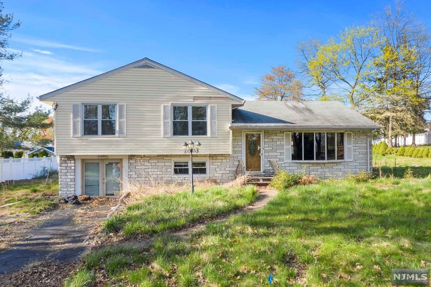 Welcome to one of the most desirable lots in Bergenfield. Stunning golf course views in front of this home, on a quiet private Cul-De-Sac. TAXES REDUCES by current owner to $14,118!! 15 Minute Drive to NYC. Investors or Flippers can renovate or tear down to build a gorgeous dream home. Building permit approved by town. Lot size 15,682. Spacious split level home w/ 3 bedrooms & 1/5 baths. large living room with bay windows, formal dining & eat in kitchen. Property as-is condition and buyers are responsible for all certs and fees. Due to conditions cash offers preferred.