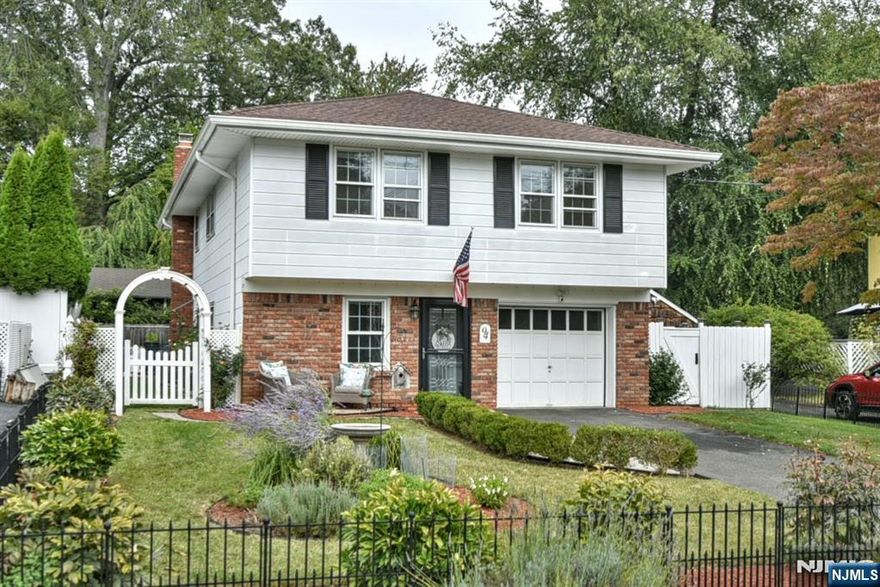 The Hillsdale opportunity youâ€™ve been waiting for! This updated bi-level offers 3 bedrooms and 2 full baths on a quiet street in one of Bergen Countyâ€™s most sought-after towns. Upstairs, youâ€™ll find a bright and open living/dining area with hardwood floors, three comfortable bedrooms, and a beautifully updated kitchen featuring granite countertops, stainless steel appliances, rich wood cabinetry, and tile flooring. The ground level offers a spacious den anchored by a wood-burning fireplace, a full bath with shower, and sliders leading out to the backyard. The outdoor space is a true highlightâ€”an expanded, L-shaped yard created by the homeâ€™s lot plus an additional side parcel included in the sale. It provides plenty of room for gardening, entertaining, or play. Additional highlights include an attached garage, a newer roof with a fully transferable warranty, and a prime location close to top-rated schools, shops/restaurants, parks, and transportation. Donâ€™t miss your chance to call Hillsdale home!