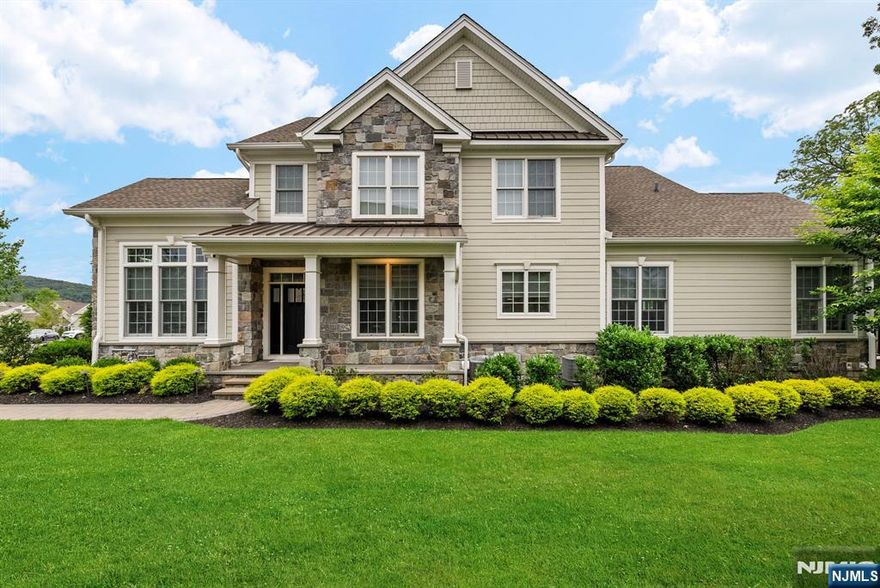 Welcome to this stunning 3 bedroom, 3 full bath and 2 half bath end-unit townhouse at The Reserve at Franklin Lakes. Built in 2018 and located in one of the most desirable locations within the community, this 3,075 square foot home plus a finished basement has an impressive 2 story entry foyer leading to the formal dining room and home office. The well appointed gourmet kitchen with large center island opens to the expanded great room with cathedral ceiling, wood beams and a triple sliding glass door that leads to the upgraded composite deck complete with an outdoor kitchen and fireplace which overlooks a private wooded view. Heading upstairs you will find an additional two bedrooms both with their own en-suite bathroom plus a large loft area perfect for a cozy seating area or second living space. The large finished basement includes luxury vinyl flooring, a kitchen area with wine fridge and center island, half bath and plenty of storage. Additional features include an expanded two car garage with epoxy floor, alarm system, exterior security cameras and so much more. Enjoy the ease of townhouse living and meeting your neighbors at the clubhouse, pool, tennis, pickleball, gym and trails.