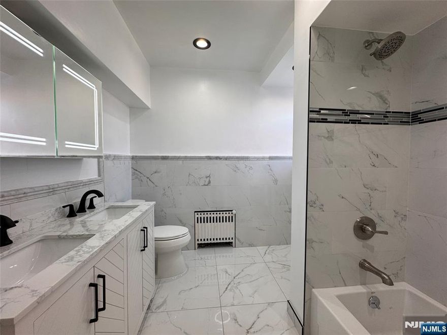 Available for immediate move-in! Welcome to your dream home in a prime location! This beautiful and spacious 3 bed / 1 bath 2nd floor apartment features a large eat-in kitchen, a bright living room, convenient in-unit laundry hookups, plenty of closet space, and a flexible bonus room. Enjoy added comfort with updated flooring, new ceiling fans and energy-efficient LED recessed lighting throughout. Freshly painted and well-maintained, this home offers ample space to relax and feel at home. The unit also includes a pull-down stairs to an oversized attic great for additional storage. Located in the heart of Lyndhurst just minutes to NJ Transit's brand-new Lyndhurst Train Station and approximately 10 miles to NYC or Hoboken. Close to top-rated schools, parks, and dining. The property also includes an oversized, fully fenced backyard with raised garden beds, large sheds, and a spacious patio for outdoor enjoyment. Great parking with both driveway and street options. Modern comfort, convenience, and community all in one great home!