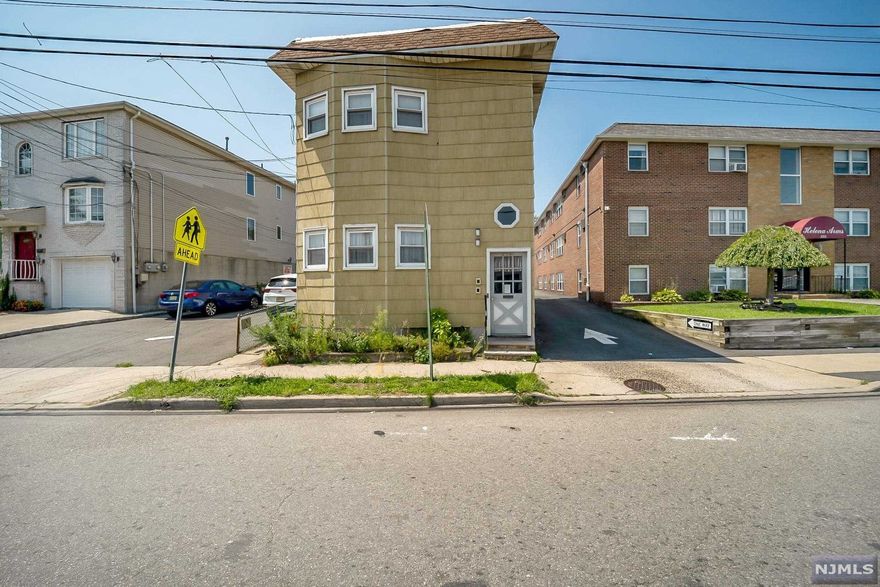 2 family investment opportunity w/3 parking spots. Each unit features Living/Dining rm combo, kitchen, 1 bedroom, bathroom. 2 separate gas hot water baseboard heating systems, 2 hot water heaters, separate gas & electric meters. Both units Tenant occupied. 1st fl pays $950 m/m w/2 parking spots, 2nd fl pays $900 m/m w/1 parking spot. No rent control in Kearny. 3 assigned spots behind deck marked A-B-C are for exclusive use of this house, balance of parking spaces/Rear part of lot is an easement on deed used by building next door. No grass to cut! Snow removal is taken care of by owner of building next door. Full unfinished basement with laundry hook ups and storage, deck off rear of house. Electric panels are Federal Pacific- Seller will not replace. 2 blocks to NJ Transit bus #40 to Harrison PATH, 1 block to shopping.