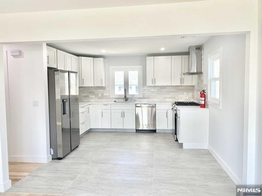 Welcome to this tastefully renovated 2-bedroom, 1-bath second-floor apartment, featuring a modern eat-in kitchen equipped with stainless steel appliances, a spacious living room, and a full bathroom with a washer and dryer. Hardwood throughout, central air conditioning, and heating. Use of garage, plus one parking space, and shared use of backyard. Tenant is responsible for all utilities and landscaping, including snow removal. Great location with easy access to the NYC bus stop, Routes 3 and 17, and the Turnpike. Required: credit score 700 Fico minimum, proof of income & lease application.