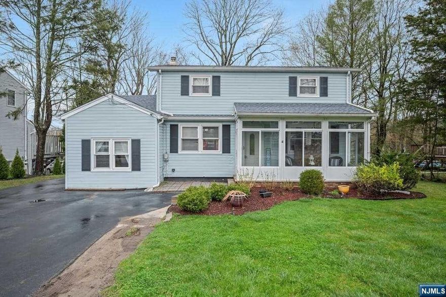 WELL APPOINTED CENTER HALL COLONIAL ON .37 ACRE. WELCOMING ENCLOSED PORCH, FRONT TO BACK LIVING ROOM,FORMAL DINING ROOM,UPDATED KITCHEN, LAUNDRY ROOM, FIRST FLOOR BEDROOM(PREVIOUS 1 CAR GARAGE)SLIDING GLASS DOORS TO A MASSIVE DECK OVERLOOKING THE YARD AND FULL BATH COMPLETE THE FIRST FLOOR, UPSTAIRS YOU WILL FIND 2 NICE SIZED BEDROOMS TO THE RIGHT AND TO THE LEFT A COMFORTABLE MASTER WITH A LARGE WALK IN CLOSET-FULL BATH BETWEEN THE BEDROOMS. THE LOWERE LEVEL IS SPACIOUS AND OPEN FOR A REC ROOM/GYM OR FAMILY ROOM, SEPARATE STORAGE ROOM AND ENCLOSED UTILITIES. DOUBLE WIDE DRIVEWAY AND NEWLY EXPANDED PARKING AREA FOR 3 ADDITIONAL VEHICLES, FIRE PIT AREA, TIERED LANDSCAPE DESIGN WITH HARDSCAPE STAIRS, STORAGE SHED("AS IS") AND FENCED YARD COMPLETE THE OUTSIDE AREA. CLOSE TO 287,23,202,208 SHOPPING, RESTARAUNTS AND MORE...