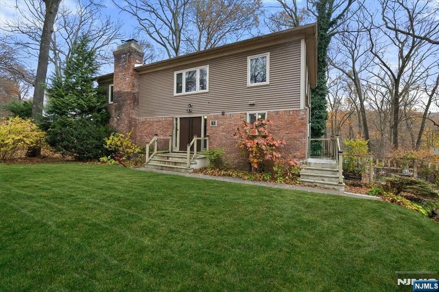 Welcome to this inviting colonial set on a generous 0.41-acre lot in the desirable Erskine Lake section of Ringwood, where optional lake membership offers a true lifestyle bonus. Surrounded by peaceful, wooded privacy, this home provides the perfect blend of tranquility and convenienceâ€”close to major commuting routes, shopping, parks, and all that Ringwoodâ€™s scenic community has to offer. Inside, youâ€™ll find five bedrooms and three-and-a-half baths, along with an impressive amount of living and entertaining space. The main level features a spacious kitchen with a center island and large dining area, a comfortable living room with a fireplace, a family room, and a full bath. Upstairs, the primary suite offers a cozy fireplace and private bath. Three additional bedrooms and a full hall bath complete the second level. The walk-out lower level includes a recreation room, an additional bedroom, a powder room, and a utility areaâ€”perfect for guests or a home office. Step outside to enjoy a paver patio, composite deck, and outdoor bar; your own warm-weather oasis! Additional features include hardwood floors, central air, boiler (2024), and septic (2019). This is a wonderful opportunity to make a spacious, beautifully situated home your own in one of Ringwoodâ€™s most picturesque neighborhoods.