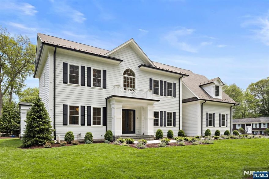 THE BEST NEW-CONSTRUCTION VALUE IN BERGEN COUNTY! Experience the Pinnacle of Modern Luxury with this exceptional New Construction Masterpiece by East Hill Development in the heart of Ramsey. Set on a rare & lush 0.6-acre lot exuding privacy, this approx. 8,000 SF showpiece spans three levels of expertly crafted design & upscale comfort. Featuring 6 bedrooms & 6.5 baths, every inch of this home blends elegance with functionality. Enjoy soaring 10-ft ceilings, exclusive lighting fixtures, custom designer kitchen with top-tier appliances w 2nd chefs kitchen, & a stunning custom walnut suspended glass cable wine display that commands attention. The primary suite offers a true escape with a gas fireplace, spa-inspired bath & shower, coffee bar, dual WIC, and its own climate control. A fully finished lower level includes a gym, custom theater, entertainment area & flexible living space for a playroom, office or bedroom. Step outside to a covered terrace with a built-in grill, refrigeration & sink perfect for seamless indoor-outdoor entertaining. With premium finishes throughout, smart home tech ready, 6-zone HVAC, 3-car garage, Belgium Block driveway, & more, this home leaves nothing to be desired. Close to top-rated schools, town pool & water park, Ramsey Golf & Country Club, 2 train stations, & downtown, this is complete luxury reimagined.