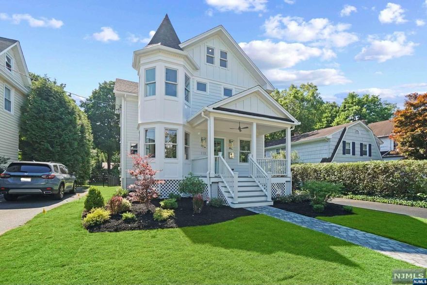 Located in the heart of Ridgewood, this transitional Victorian offers the best of village living with walking distance to downtown restaurants, coffee shops, and shopping. Expanded & renovated to the studs, with new insulation, drywall, Hardie siding, roof, heating/AC, plumbing, and electrical systems. Inside, you'll find premium trimming, beautiful light fixtures, and white oak floors. The 1st floor boasts 9ft ceilings, glass partitioned office space, open kitchen with large Cambria stone island, Subzero fridge, and Wolf range/oven/microwave, a chef's dream. The family room features coffered ceiling and fireplace, and the mudroom connects to the backyard and detached garage. The 2nd floor includes a master suite with spacious bath and his-and-her walk-in closets. 2nd flr also has an ensuite bedroom, and two additional bedrooms sharing hall bathroom. The fully finished basement has a bar, recreational area, bedroom, and full bathroom. Seller holds NJ RE Lic