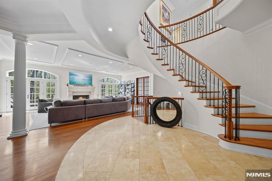 Open House Sunday 5/3 1-3pm, please call Tali for access 917-514-2335 Welcome to 713 Bellaire Road, set at the highest point within Demarestâ€™s coveted Bellaire community. Spanning nearly 6,000 SF, this exceptional residence is a study in elevation, scale, and refinement converge, along with the opportunity to obtain exclusive membership to Alpine Country Club for an additional fee. A dramatic two-story foyer introduces the home beneath a statement chandelier, while a sculptural staircase sets an architectural tone of quiet sophistication.Fireplaces on all three levels create a layered sense of warmth throughout expansive, thoughtfully designed interiors, while a private elevator provides effortless access to every level. With 5 bedrooms, 4 full baths, and 2 powder rooms, the layout is both grand and effortlessly livable. The primary suite offers a true sense of retreat, complete with a boutique-style dressing room and a spa-caliber bathroom. An adjoining private lounge with wet bar adds versatility, ideal as a nursery or additional bedroom. At the heart of the home, the kitchen delivers both presence and performance, appointed with elite appliances, granite surfaces, and custom cabinetry. A refined breakfast bar transitions seamlessly into a sunlit morning room. Designed with entertaining in mind, a private theater and seamless indoor-outdoor flow lead to a striking two-story deck and patio.