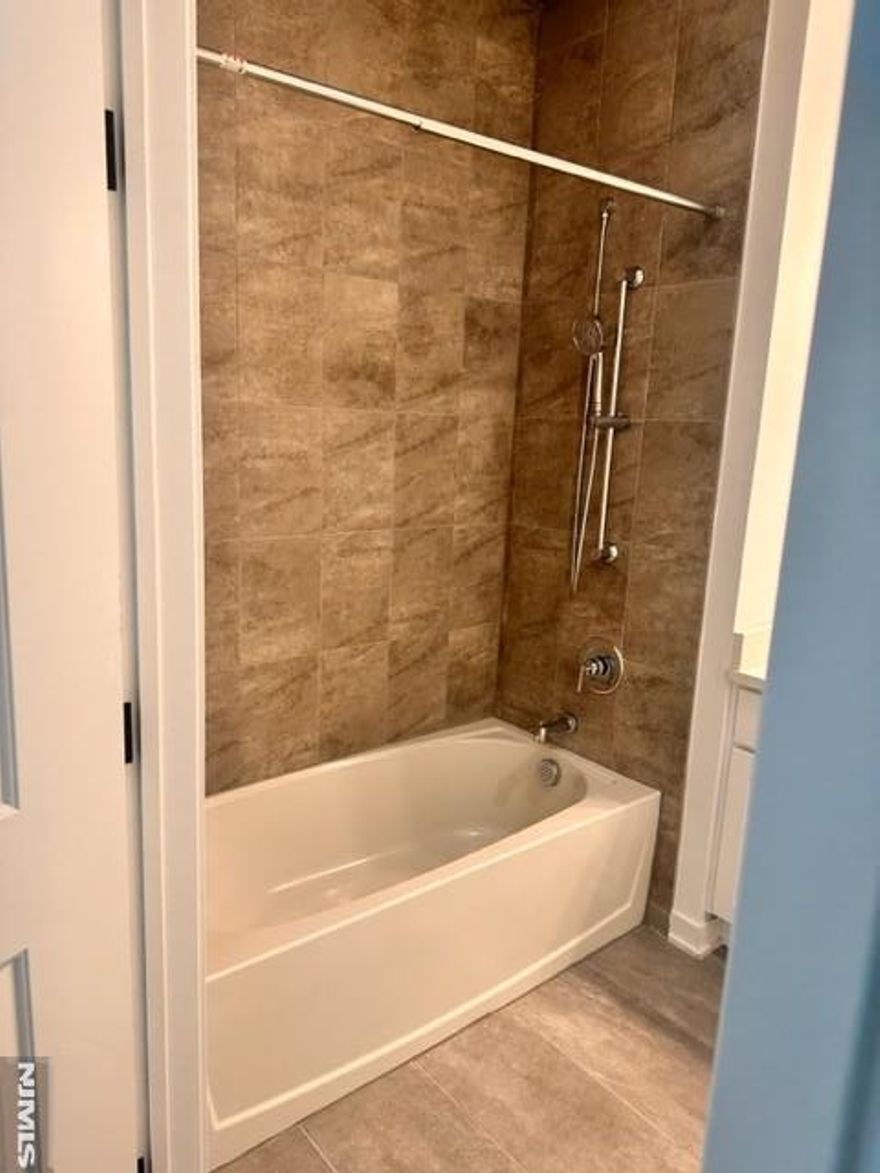 Experience modern living at its best with No extra Fees! This beautiful 1 bedroom/1 bath unit includes a modern kitchen with stainless steel appliances, a spacious walk-in closet,, in unit washer and dryer! Enjoy the open-concept layout, Conveniently located near public transportation to NYC, shopping, dining, school and 5 min. to Metlife stadium. Security deposit reduced! This is truly a MUST-SEE!