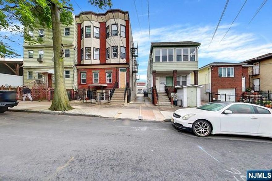 Welcome to this pristine 6 family building, great for owner occupied or as an investment property. Very well kept and cared for, this unit is located at 54 Davenport Ave in Newark, NJ, just a few blocks from the beautiful Branch Brook Park and conveniently close to NJ Transit. Each of the six apartments boasts spacious eat-in kitchens, living rooms, 1 bedroom, and a full bathroom. Full finished basement with 3 separate entrances provides additional rooms, closets, full bath and storage. This building is equipped with 7 electric meters, 7 gas meters and a common basement area with laundry hook ups. Exclusive driveway and additional parking in the large yard area, ideal for extra monthly income. This home is a must-see! Strictly "As is" Schedule your showing today!