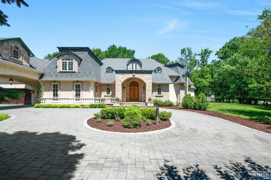 Come and experience the magic of this extraordinary estate where history meets luxury in perfect symphony.This custom built French Chateau exudes elegance and sophistication and is sure to delight even the most discerning buyers.The dedication, care and attention to detail in this home is unrivaled with impeccable quality of craftsmanship.step through antique front door into a world of refined elegance.The foyer welcomes you with its soaring ceilings,and magnificent marble bridal staircase. 2 story kitchen includes Clive Christian cabinets, island and top of the line appliances. Beautiful fam. room with cathedral ceiling and 18th century imported wood burning fireplace.The spacious primary suite offers a spa like bathroom with a marble soaking tub, custom vanities and a gorgeous walk in closet.Beautiful grounds with a covered patio, outdoor kitchen, a marvelous pool, and lush gardens provide a tranquil escape, perfect for gathering. Custom windows and doors, radiant heat and mor