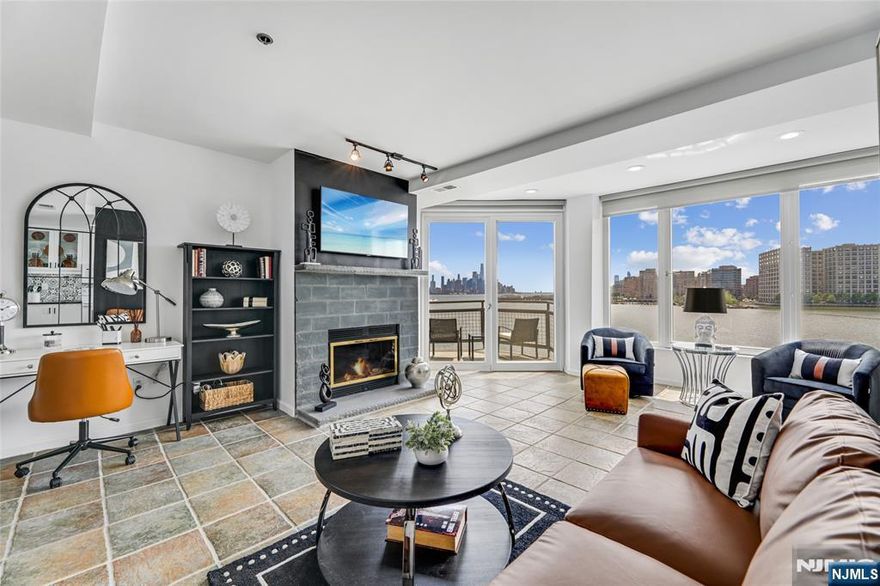 A commuterâ€™s dream meets luxurious living! Perched along the Gold Coast waterfront, this exquisite apartment offers sweeping Hudson River and skyline views that dazzleâ€”especially at sunset, best enjoyed from your private balcony. Every detail inside has been curated for modern living. Cozy up by the wood-burning fireplace, prepare meals on sleek granite countertops, or unwind in the newly renovated powder room and spa-like primary bathroom. Sunlight floods through large windows, illuminating the open dining area, while the in-unit washer/dryer provides convenient access. This full-service building elevates amenities: 24-hour concierge, elevator, free assigned parking, a state-of-the-art gym, and a heated indoor pool. Step outside, and youâ€™re just moments from Whole Foods, Ruthâ€™s Chris Steakhouse, boutique shopping, and vibrant dining options. And for commuters? The ferry is only a short distance away, whisking you to Midtown Manhattan in a speedy 8 minutes. Donâ€™t let this one-of-a-kind home pass you byâ€”schedule your tour today!