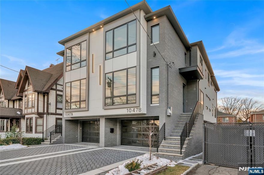 INTRODUCING 1047 ANDERSON AVE, AN OVER-SIZED, ONE OF A KIND, TOWNHOUSE FEATURING 4100 SQ FT, BUILT BY MB CUSTOM BUILDERS. THIS LUXURIOUS HOME BOASTS 3 LEVELS OF LIVING SPACE. MAIN LEVEL- 10' CEILINGS, OPEN CONCEPT, FAMILY ROOM WITH FIREPLACE HIGHLIGHTED BY WOOD AND BLACK ACCENTS AND INTERGRATED LIGHTING IN SHELVES, DINING ROOM, MODERN EAT IN KITCHEN OVERSIZED ISLAND, GE MONOGRAM/CAFE APPLIANCES, AND UNDER MOUNT CABINET LIGHTING, BUILT IN BREAKFAST NOOK, LIVING ROOM WITH ACCENT WALL, AND SLIDING GLASS DOOR TO DECK....2ND FLOOR-PRIMARY BEDROOM WITH FIREPLACE, TWO WALK IN CLOSETS, OVERSIZED WINDOWS AND SPA LIKE BATH WITH HIS AND HER RAIN SHOWER AND TUB, 3 ADDITIONAL JUNIOR SUITES WITH WALK IN CLOSETS AND LAUNDRY COMPLETE THE 2ND FLOOR. GROUND FLOOR- RECREATION ROOM WITH 12â€™ CEILINGS, WET BAR, FULL BATH, SLIDING GLASS DOOR TO A NICE SIZE YARD, GARAGE, AND MUDROOM....ADDITIONAL FEATURES-MULTI ZONE HEATING AND COOLING, CUSTOM MOLDINGS THROUGHOUT, SECURITY CAMERAS, AND MULTI ZONE SPEAKER SYSTEM.