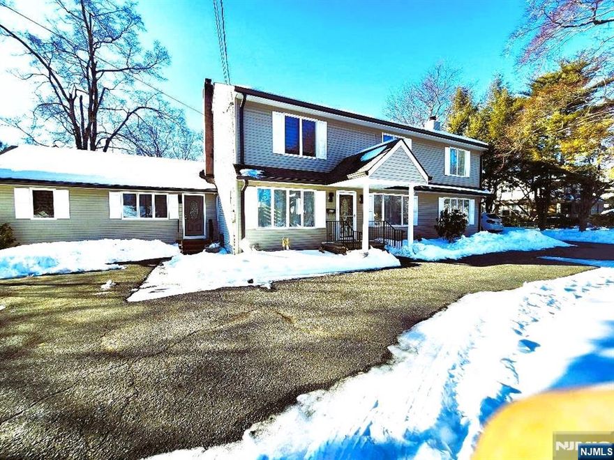 Beautifully Renovated 5-Bedroom, 3.5-Bath Colonial â€“ Move-In Ready! Welcome to this stunning 5-bedroom, 3.5-bath colonial, completely renovated in 2025 and thoughtfully designed for modern living. This home offers a spacious and functional layout, ideal for both everyday comfort and entertaining. The first floor features elegant tile flooring throughout and includes a bright living room with a wood-burning fireplace, a formal dining room, and a spacious family room. The modern kitchen is beautifully appointed with quartz countertops, ample cabinetry, and quality finishes, with direct access to a deck overlooking a private backyardâ€”perfect for outdoor enjoyment. Designed with extended family living in mind, the first floor also offers a private guest bedroom and full bathroom, creating an ideal guest suite for in-laws, or visitors. A convenient laundry room and powder room complete the main level. The second floor features hardwood flooring throughout and includes a spacious primary suite with a private bath, along with three additional generously sized bedrooms and a full hallway bathroom. Additional highlights include a finished basement, a 3-zone HVAC system for optimal comfort, abundant natural light, and a well-balanced layout that provides both privacy and open living spaces.